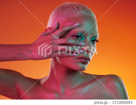 Neon, cosmetics and beauty, woman with hand in face, makeup and light in creative advertising on orange background. Cyberpunk, art and model isolated in skincare and futuristic mockup space in studio Neon, cosmetics and beauty, woman with hand in face, makeup and light in creative advertising on orange background. Cyberpunk, art and model isolated in skincare and futuristic mockup space in studio 131800093