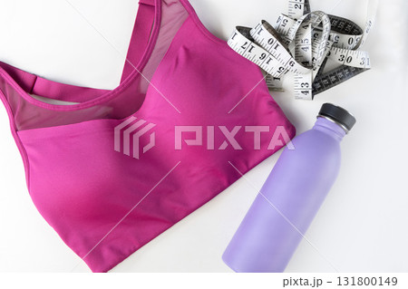 Concept of sports lifestyle and sports activities. Flat lay of sports top bra and drinking bottle. Concept of sports lifestyle and sports activities. Flat lay of sports top bra and drinking bottle. 131800149