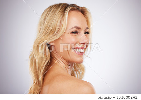 Skincare, happy and mature woman in studio for beauty, wellness and grooming on grey background space. Cosmetic, body care and female model relax in luxury, hygiene and dermatology while isolated 131800242