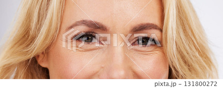 Skincare, eyes and zoom, mature woman in anti ageing treatment portrait isolated on grey background in studio. Health, skin and beauty, happy model face, eye closeup in luxury spa collagen facial. Skincare, eyes and zoom, mature woman in anti ageing treatment portrait isolated on grey background in studio. Health, skin and beauty, happy model face, eye closeup in luxury spa collagen facial. 131800272