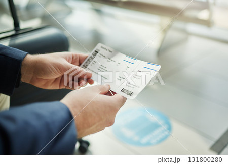 Plane ticket in hands, travel and person at airport, waiting on flight for business trip, check in and boarding. Closeup, .professional conference or convention with travelling for work and journey Plane ticket in hands, travel and person at airport, waiting on flight for business trip, check in and boarding. Closeup, .professional conference or convention with travelling for work and journey 131800280