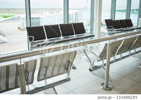 Background of empty airport, terminal lounge and chair furniture in waiting room. Airplane lobby, seat and space of commercial flight, clean building interior and global travel design for journey 131800285