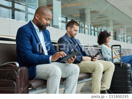 Lobby, airport and people on technology for online flight booking, information or travel schedule. Digital app, news and business black man on tablet for immigration, international or job opportunity Lobby, airport and people on technology for online flight booking, information or travel schedule. Digital app, news and business black man on tablet for immigration, international or job opportunity 131800295