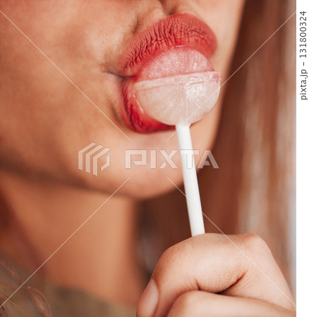 Lollipop, woman and mouth closeup with makeup, cosmetic and beauty while eating sweet candy. Lips, young person and hungry female model with a girl pout with sweets and cosmetics for youth aesthetic Lollipop, woman and mouth closeup with makeup, cosmetic and beauty while eating sweet candy. Lips, young person and hungry female model with a girl pout with sweets and cosmetics for youth aesthetic 131800324
