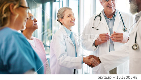 Handshake, team partnership or meeting of doctors welcome onboarding employee for medical healthcare. Shaking hands, teamwork or hospital nurses, surgeon or winner smile for promotion achievement Handshake, team partnership or meeting of doctors welcome onboarding employee for medical healthcare. Shaking hands, teamwork or hospital nurses, surgeon or winner smile for promotion achievement 131800348