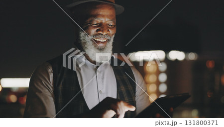 Working, tablet and mature business man with tablet on city roof at night on break with social media. Ceo and smile of African entrepreneur with professional work and company with reading article 131800371