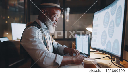 Black man, night and work at computer, typing and research for senior manager at creative agency. Office, late and professional businessman for website, technology and web design deadline at overtime Black man, night and work at computer, typing and research for senior manager at creative agency. Office, late and professional businessman for website, technology and web design deadline at overtime 131800390