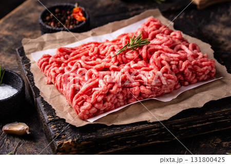 Raw minced meat on dark background Raw minced meat on dark background 131800425