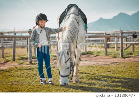 Smile, portrait and horse with of girl on countryside for riding, equestrian and affectionate. Pet, pasture and stallion with child jockey and animal on nature ranch for relax, travel or weekend Smile, portrait and horse with of girl on countryside for riding, equestrian and affectionate. Pet, pasture and stallion with child jockey and animal on nature ranch for relax, travel or weekend 131800477