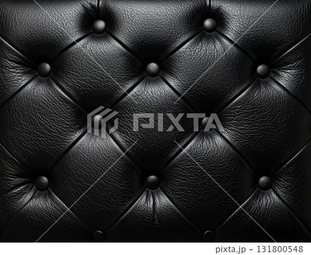 Black leather tufted upholstery creating elegant background texture 131800548
