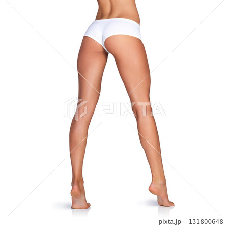 Back, legs and woman in underwear in studio for grooming, smooth and soft against a white background. Body care, leg and girl model relax on mockup for skin, glow or luxury beauty while isolated 131800648