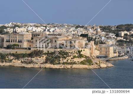 The historic Bighi Complex in Kalkara, Malta, featuring imposing architecture and coastal views along Triq Marina. Cultural heritage of Malta The historic Bighi Complex in Kalkara, Malta, featuring imposing architecture and coastal views along Triq Marina. Cultural heritage of Malta 131800694