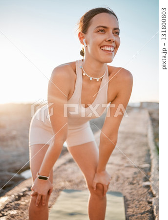 Fitness rest, woman and happy from running exercise, marathon training and summer workout. Smile face, female runner and earphones to break with happiness, breathing and motivation of wellness goals Fitness rest, woman and happy from running exercise, marathon training and summer workout. Smile face, female runner and earphones to break with happiness, breathing and motivation of wellness goals 131800803