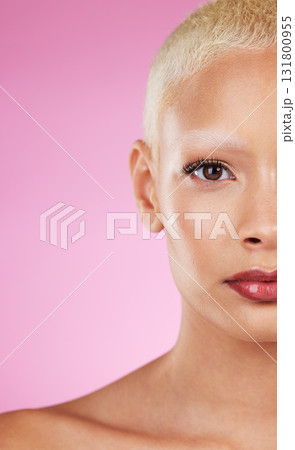 Beauty, half face and woman in portrait with makeup, skincare glow, eye and healthy skin on pink background. Natural cosmetics, lashes and mockup space, dermatology and cosmetic shine with wellness 131800955