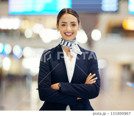 Woman, airport and passenger assistant with arms crossed standing ready with smile in FAQ, help or direction. Portrait of happy female airline service agent smiling for immigration or travel services Woman, airport and passenger assistant with arms crossed standing ready with smile in FAQ, help or direction. Portrait of happy female airline service agent smiling for immigration or travel services 131800967
