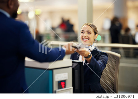 Woman, airport and service agent with passport helping traveler for check in at terminal counter. Female passenger assistant with smile in travel security or immigration documents for airline control 131800971