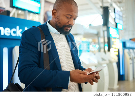 Black man, plane ticket check and document with international airport information for travel. Flight data, businessman and luggage of a African employee reading passport info for airplane immigration Black man, plane ticket check and document with international airport information for travel. Flight data, businessman and luggage of a African employee reading passport info for airplane immigration 131800988
