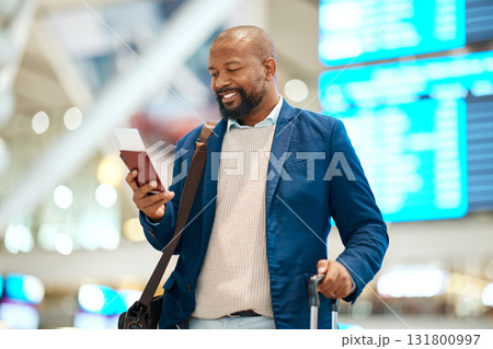 Black man in airport with passport, ticket and smile, travelling to foreign country for business trip. Visa, travel and happy businessman waiting for flight time to international destination for work 131800997