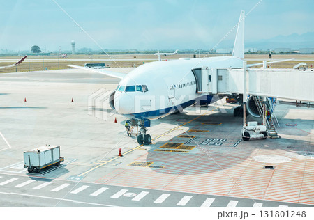 Airplane, airport and runway near terminal and boarding steps for a flight for travel, logistics or commercial transport. Plane, aircraft and airline vehicle outdoors in Cape Town International Airplane, airport and runway near terminal and boarding steps for a flight for travel, logistics or commercial transport. Plane, aircraft and airline vehicle outdoors in Cape Town International 131801248