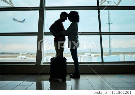 Airport, couple and silhouette of love, hug and leaving on vacation on a airplane flight. Plane departure, holiday and young people shadow by a window for journey, vacation break or immigration 131801261