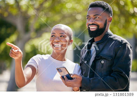 Happy, phone and pointing with black couple in city for directions, travel and summer date. Smile, love and bonding with man and woman in urban town for technology, social and happiness together Happy, phone and pointing with black couple in city for directions, travel and summer date. Smile, love and bonding with man and woman in urban town for technology, social and happiness together 131801389