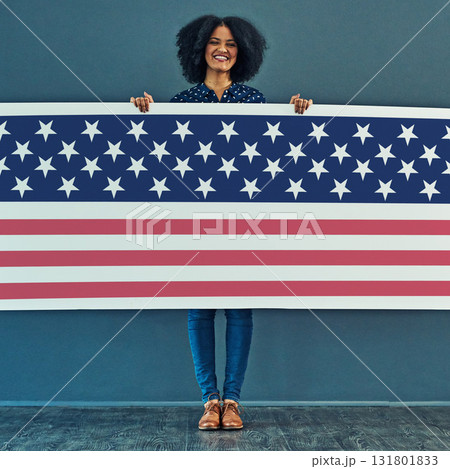 Portrait, American flag and woman with smile, patriotic and pride for country against a wall. Face, female and person with USA symbol, confidence and motivation for freedom, human rights or happiness 131801833