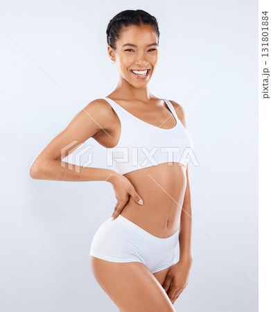 Health, smile and body care, portrait of woman in underwear with healthy diet and exercise in studio. Fitness, nutrition and skincare, wellness and model with slim figure isolated on grey background. 131801884
