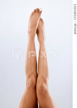 Legs, feet and skin with woman and beauty, epilation with laser hair removal, waxing and pedicure on studio background. Skincare, dermatology and spa treatment with cosmetics, glow and mockup space Legs, feet and skin with woman and beauty, epilation with laser hair removal, waxing and pedicure on studio background. Skincare, dermatology and spa treatment with cosmetics, glow and mockup space 131801921