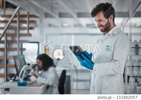 Science, research and man with tablet standing in laboratory, internet search and medical data online. Healthcare, pharmaceutical innovation and happy scientist with smile, technology and analytics. Science, research and man with tablet standing in laboratory, internet search and medical data online. Healthcare, pharmaceutical innovation and happy scientist with smile, technology and analytics. 131802057