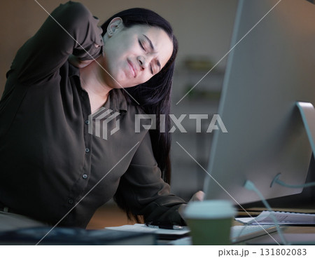 Woman with neck pain, working at night in office with computer and mental health of corporate business worker. Young overworked person at desk, backache from late workload and employee burnout 131802083