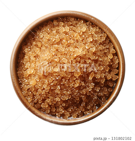 Brown sugar crystals filling a small wooden bowl from an overhead perspective on transparent background Brown sugar crystals filling a small wooden bowl from an overhead perspective on transparent background 131802102