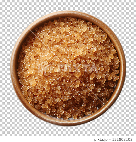 Brown sugar crystals filling a small wooden bowl from an overhead perspective on transparent background Brown sugar crystals filling a small wooden bowl from an overhead perspective on transparent background 131802102