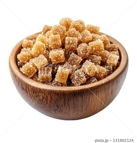 Close up shot of candied ginger cubes in wooden bowl on transparent background Close up shot of candied ginger cubes in wooden bowl on transparent background 131802124