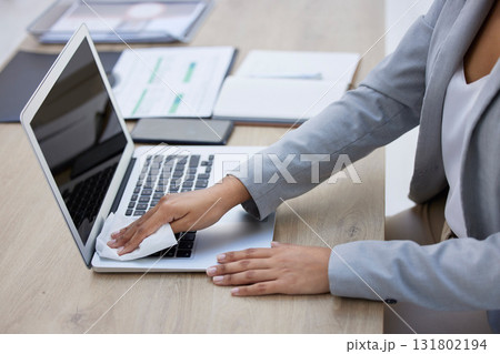 Hands, laptop or cleaning cloth for hygiene, wellness or bacteria protection in modern corporate office. Business woman, technology or wiping dust for health maintenance, safety or virus disinfection Hands, laptop or cleaning cloth for hygiene, wellness or bacteria protection in modern corporate office. Business woman, technology or wiping dust for health maintenance, safety or virus disinfection 131802194