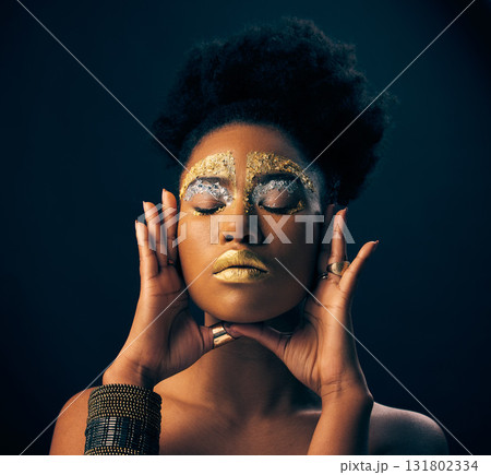 Beauty, gold and metallic with black woman and makeup in studio for luxury, cosmetics and African pride. Natural, creative and goddess with female model on background for queen, bronze or glamour art 131802334