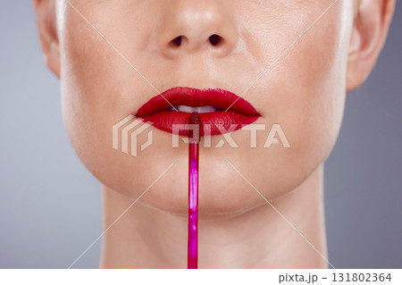 Red lipstick, lips and woman isolated on a studio background for makeup or product promotion. Model face with mouth closeup for cosmetics gloss, shine or color makeup stick with skincare and beauty Red lipstick, lips and woman isolated on a studio background for makeup or product promotion. Model face with mouth closeup for cosmetics gloss, shine or color makeup stick with skincare and beauty 131802364