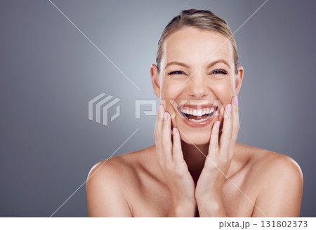 Portrait, skincare and woman with smile, dermatology and makeup with girl on grey studio background. Face, female and lady with happiness, joyful and cosmetics for grooming, salon treatment or luxury Portrait, skincare and woman with smile, dermatology and makeup with girl on grey studio background. Face, female and lady with happiness, joyful and cosmetics for grooming, salon treatment or luxury 131802373