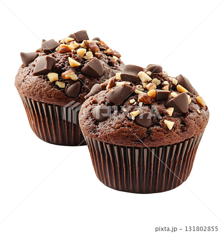 Two delicious chocolate muffins are topped with nuts on transparent background Two delicious chocolate muffins are topped with nuts on transparent background 131802855