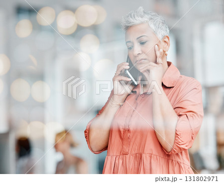 Phone call, sad and senior business woman talking, chatting or speaking in workplace. Bokeh window, communication and elderly female with depression, networking or discussion on mobile smartphone. Phone call, sad and senior business woman talking, chatting or speaking in workplace. Bokeh window, communication and elderly female with depression, networking or discussion on mobile smartphone. 131802971