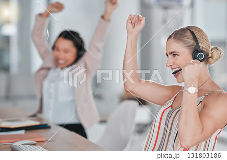 Woman, call center and team celebration for winning, promotion or sales bonus in telemarketing at the office. Happy female consultants celebrating victory, deal or teamwork success in contact us 131803186