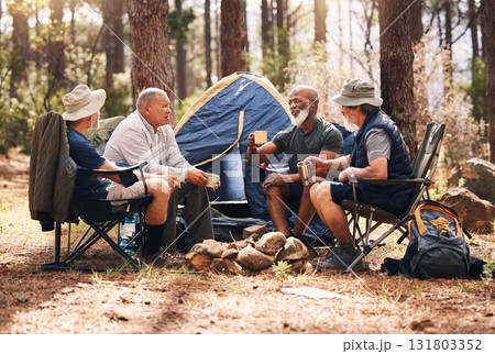 Man, friends and camping in nature with coffee for travel, adventure or summer vacation together on chairs by tent in forest. Group of men relaxing, talking or enjoying natural camp by trees outdoors Man, friends and camping in nature with coffee for travel, adventure or summer vacation together on chairs by tent in forest. Group of men relaxing, talking or enjoying natural camp by trees outdoors 131803352
