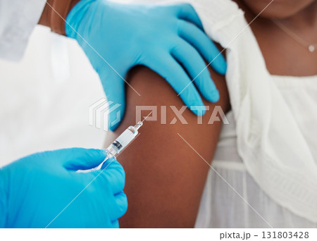 Hand, covid vaccine and a patient closeup with her doctor in a hospital for an injection of medicine antibiotics. Healthcare, medical and consulting with a healthcare professional holding a syringe 131803428