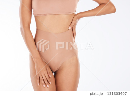 Health, slim and body of a woman in underwear isolated on a white background in a studio. Wellness, beauty and stomach of a fitness girl with a slimming shape, attradctive and in swimwear on backdrop Health, slim and body of a woman in underwear isolated on a white background in a studio. Wellness, beauty and stomach of a fitness girl with a slimming shape, attradctive and in swimwear on backdrop 131803497