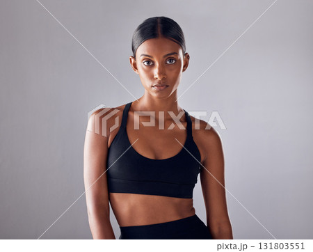 Fitness, motivation and health with portrait of indian woman for training, workout and wellness goals. Exercise, diet and mindset with girl athlete for mission, cardio and sports in studio background Fitness, motivation and health with portrait of indian woman for training, workout and wellness goals. Exercise, diet and mindset with girl athlete for mission, cardio and sports in studio background 131803551