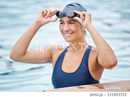 Swimming pool, sports and face of woman swimmer ready for training, water polo game and exercise in gym. Fitness, wellness and happy female athlete smile for competition, workout and race challenge 131803552