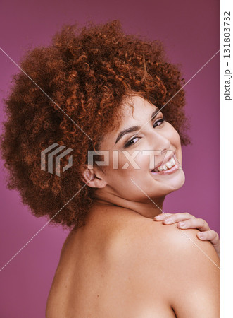 Happy woman, shoulder and afro hairstyle portrait in empowerment, curly maintenance or skincare salon. Smile, beauty model or natural hair texture on cosmetics studio or on isolated purple background 131803732