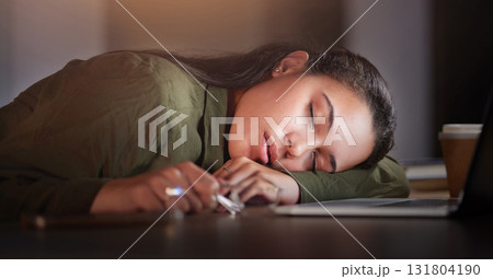 Tired, business woman and sleeping in office at night with burnout, stress problem and low energy in evening. Fatigue, lazy and overtime female employee nap at table, deadlines and rest of overworked 131804190