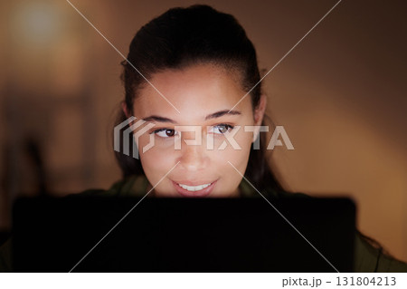 Woman, happy business and laptop at night for planning online strategy, research and company in dark office. Young female worker working overtime on computer for deadlines, productivity or technology 131804213