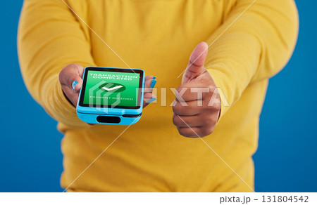 Phone screen, transaction and person thumbs up for payment success in e commerce, online shopping and mobile app. Yes, like and thank you sign of woman with machine and fintech check mark in studio Phone screen, transaction and person thumbs up for payment success in e commerce, online shopping and mobile app. Yes, like and thank you sign of woman with machine and fintech check mark in studio 131804542