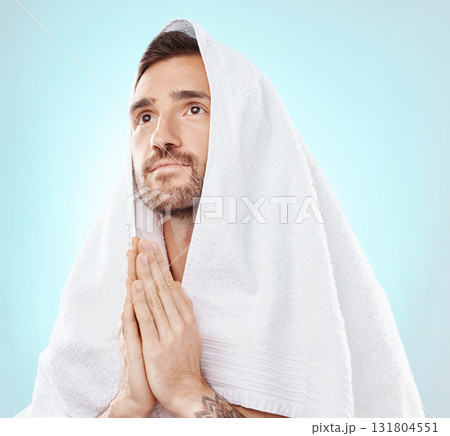 Prayer, thinking and worship with man and towel for hope, spiritual and Catholic faith. Respect, religion and Holy spirit with guy and hands for believer, humble and Christianity with blue background 131804551